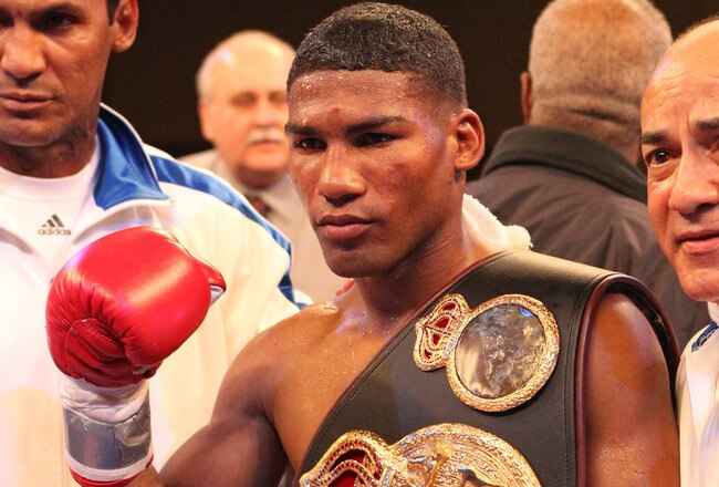 ATLANTIC CITY, NJ - MARCH 26: Yuriorkis Gamboa wears the championship belt after winning the IBF WBA World Featherweight title by beating Jorge Solis of Mexico during Top Rank's 'Featherweight Fury' on March 26, 2011 at Boardwalk Hall in Atlantic City, New Jersey. (Photo by Hunter Martin/Getty Images)