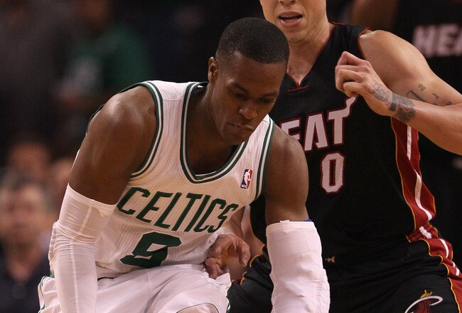 BOSTON, MA - MAY 09:  Rajon Rondo #9 of the Boston Celtics tries to keep the ball from Mike Bibby #0 of the Miami Heat in Game Four of the Eastern Conference Semifinals in the 2011 NBA Playoffs on May 9, 2011 at the TD Garden in Boston, Massachusetts.  The Miami Heat defeated the Boston Celtics 98-90 in overtime. NOTE TO USER: User expressly acknowledges and agrees that, by downloading and or using this photograph, User is consenting to the terms and conditions of the Getty Images License Agreement.  (Photo by Elsa/Getty Images)