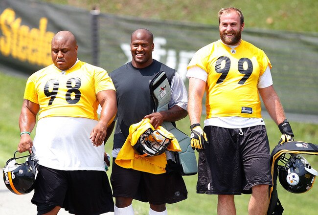LATROBE, PA - JULY 29: Casey Hampton #98, James Harrison #92, and Brett Keisel #99 of the Pittsburgh Steelers walk down to the field during training camp on July 29, 2011 at St Vincent College in Latrobe, Pennsylvania.  (Photo by Jared Wickerham/Getty Images)