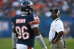 CHICAGO - NOVEMBER 08: Head coach Lovie Smith of the Chicago Bears watches as his defensive players including Alex Brown #96 leave the field late in a game against the Arizona Cardinals at Soldier Field on November 8, 2009 in Chicago, Illinois. The Cardinals defeated the Bears 41-21. (Photo by Jonathan Daniel/Getty Images)