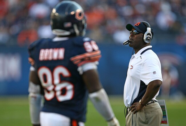 CHICAGO - NOVEMBER 08: Head coach Lovie Smith of the Chicago Bears watches as his defensive players including Alex Brown #96 leave the field late in a game against the Arizona Cardinals at Soldier Field on November 8, 2009 in Chicago, Illinois. The Cardinals defeated the Bears 41-21. (Photo by Jonathan Daniel/Getty Images)