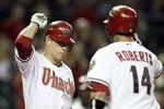 PHOENIX, AZ - AUGUST 29:  Aaron Hill #2 (L) of the Arizona Diamondbacks high fives Ryan Roberts #14 after Roberts hit a solo home run against the Colorado Rockies during the first inning of the Major League Baseball game at Chase Field on August 29, 2011 in Phoenix, Arizona.  (Photo by Christian Petersen/Getty Images)