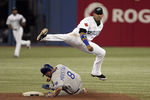 TORONTO, CANADA - AUGUST 24: Yunel Escobar #5 of the Toronto Blue Jays makes the double play on Mike Moustakas #8 of the Kansas City Royals during MLB action at Rogers Centre August 24, 2011 in Toronto, Ontario, Canada. (Photo by Abelimages/Getty Images)
