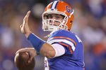 GAINESVILLE, FL - NOVEMBER 13: John Brantley #12 of the Florida Gators warms up during a game against the South Carolina Gamecocks at Ben Hill Griffin Stadium on November 13, 2010 in Gainesville, Florida.  (Photo by Mike Ehrmann/Getty Images)