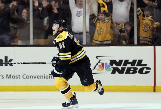 BOSTON - MAY 01:  Marc Savard #91 of the Boston Bruins celebrates his game winning goal in the overtime period against the Philadelphia Flyers in Game One of the Eastern Conference Semifinals during the 2010 NHL Stanley Cup Playoffs at TD Garden on May 1, 2010 in Boston, Massachusetts. The Bruins defeated the Flyers 5-4 in overtime.  (Photo by Elsa/Getty Images)