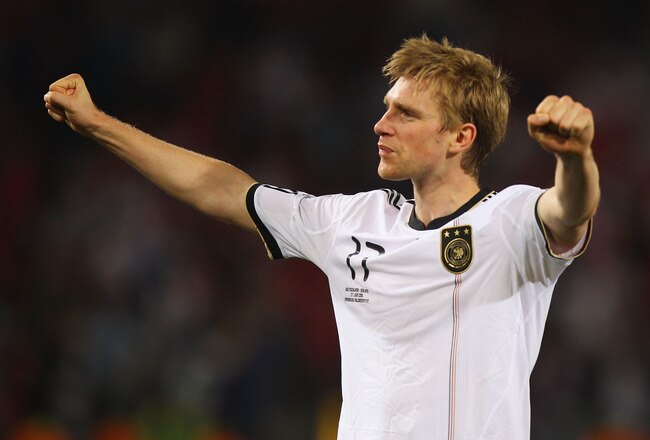 BLOEMFONTEIN, SOUTH AFRICA - JUNE 27:  Per Mertesacker of Germany celebrates victory following the 2010 FIFA World Cup South Africa Round of Sixteen match between Germany and England at Free State Stadium on June 27, 2010 in Bloemfontein, South Africa.  (Photo by Michael Steele/Getty Images)