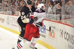 PITTSBURGH, PA - FEBRUARY 8:  Matt Cooke #24 of the Pittsburgh Penguins checks Fedor Tyutin #51 of the Columbus Blue Jackets in the first period on February 8, 2011 at CONSOL Energy Center in Pittsburgh, Pennsylvania. Cooke was assessed a five-minute major penalty for charging on the play.  (Photo by Jamie Sabau/Getty Images)