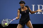 NEW YORK, NY - AUGUST 29:  Venus Williams of the United States returns the ball against Vesna Dolonts of Russia during Day One of the 2011 US Open at the USTA Billie Jean King National Tennis Center on August 29, 2011 in the Flushing neighborhood of the Queens borough of New York City.  (Photo by Julian Finney/Getty Images)