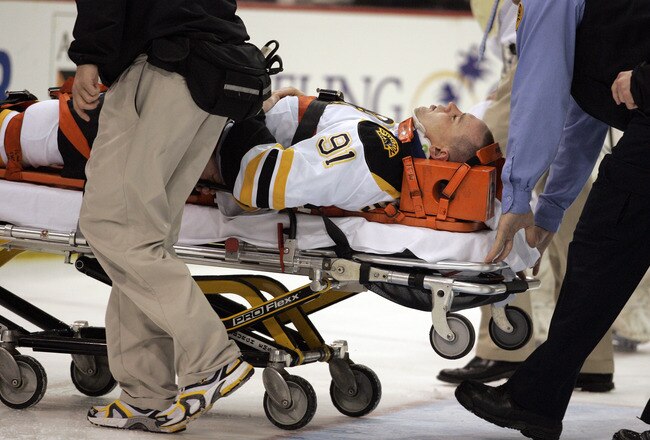PITTSBURGH, PA - MARCH 07:  Marc Savard #91 of the Boston Bruins is taken off the ice by medical staff after being injured in the third period against the Pittsburgh Penguins at Mellon Arena on March 7, 2010 in Pittsburgh, Pennsylvania.  The Penguins defeated the Bruins 2-1.  (Photo by Justin K. Aller/Getty Images)
