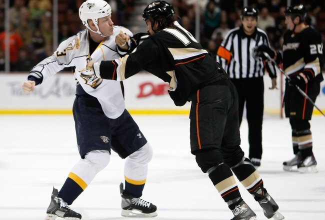 ANAHEIM, CA - NOVEMBER 05:  Wade Belak #3 of the Nashville Predators and George Parros #16 of the Anaheim Ducks fight during the second period at the Honda Center on November 5, 2009 in Anaheim, California. The Ducks defeated the Predators 4-0.  (Photo by Jeff Gross/Getty Images)