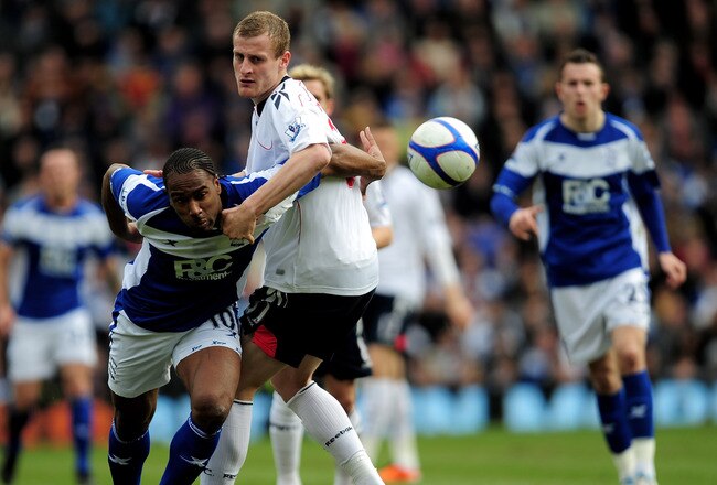 BIRMINGHAM, ENGLAND - MARCH 12:  Cameron Jerome of Birmingham City holds off a challenge from David Wheater of Bolton Wanderers during the FA Cup sponsored by E.On Sixth Round match between Birmingham City and Bolton Wanderers at St Andrews on March 12, 2011 in Birmingham, England.  (Photo by Jamie McDonald/Getty Images)