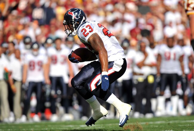 LANDOVER - SEPTEMBER 19:  Arian Foster #23 of the Houston Texans runs the ball against the Washington Redskins at FedExField on September 19, 2010 in Landover, Maryland. The Texans defeated the Redskins in overtime 30-27. (Photo by Larry French/Getty Images)