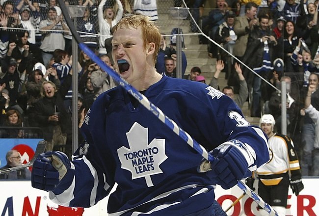 TORONTO - JANUARY 1:  Wade Belak #3 of the Toronto Maple Leafs celebrates a goal scored by teammate Kris Newbury against the Boston Bruins during their NHL game at the Air Canada Centre January 1, 2007 in Toronto, Ontario.  (Photo by Dave Sandford/Getty Images)