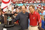 ORLANDO, FL - JANUARY 01:  Alabama Crimson Tide Head Coach Nick Saban is presented the trophy for winning the Capitol One Bowl against the Michigan State Spartans at the Florida Citrus Bowl on January 1, 2011 in Orlando, Florida.  (Photo by Mike Ehrmann/Getty Images)