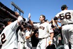 SAN FRANCISCO - AUGUST 12:  Pat Burrell #9 of the San Francisco Giants celebrates after hitting a grand slam against the Chicago Cubs in the fifth inning during an MLB game at AT&T Park on August 12, 2010 in San Francisco, California. (Photo by Jed Jacobsohn/Getty Images)