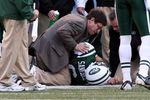EAST RUTHERFORD, NJ - NOVEMBER 29:  Mark Sanchez #6 of the New York Jets is tended too after an injury against the Carolina Panthers on November 29, 2009 at Giants Stadium in East Rutherford, New Jersey.  (Photo by Jim McIsaac/Getty Images)