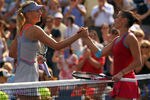 NEW YORK, NY - SEPTEMBER 02:  Flavia Pennetta (R) of Italy shakes hands with Maria Sharapova of Russia after defeating her during Day Five of the 2011 US Open at the USTA Billie Jean King National Tennis Center on September 2, 2011 in the Flushing neighborhood of the Queens borough of New York City.  (Photo by Nick Laham/Getty Images)