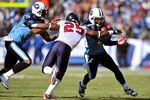 NASHVILLE, TN - DECEMBER 19:  Chris Johnson #28 of the Tennessee Titans braks away from Kareem Jackson #25 of the Houston Texans during the first half at LP Field on December 19, 2010 in Nashville, Tennessee.  (Photo by Grant Halverson/Getty Images)