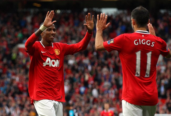 MANCHESTER, ENGLAND - AUGUST 28:  Ashley Young of Manchester United celebrates with Ryan Giggs after scoring his second goal during the Barclays Premier League match between Manchester United and Arsenal at Old Trafford on August 28, 2011 in Manchester, England.  (Photo by Alex Livesey/Getty Images)