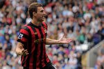 BOLTON, ENGLAND - AUGUST 21:  Edin Dzeko of Manchester City celebrates scoring his team's third goal during the Barclays Premier League match between Bolton Wanderers and Manchester City at the Reebok Stadium on August 21, 2011 in Bolton, England.  (Photo by Michael Regan/Getty Images)