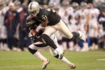 OAKLAND, CA - DECEMBER 19:  Syd'Quan Thompson #22 of the Denver Broncos is tackled by Hiram Eugene #31 of the Oakland Raiders at Oakland-Alameda County Coliseum on December 19, 2010 in Oakland, California.  (Photo by Ezra Shaw/Getty Images)
