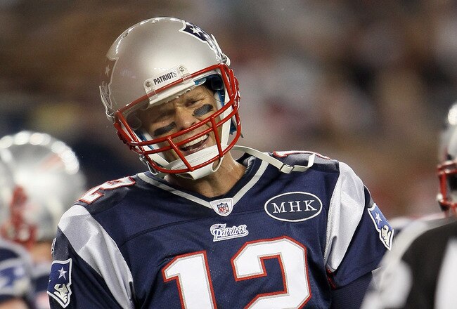 FOXBORO, MA - SEPTEMBER 01:   Tom Brady #12 of the New England Patriots reacts after the play is initially called short in the endzone against the New York Giants on September 1, 2011 at Gillette Stadium in Foxboro, Massachusetts.The play was later ruled a touchdown. (Photo by Elsa/Getty Images)