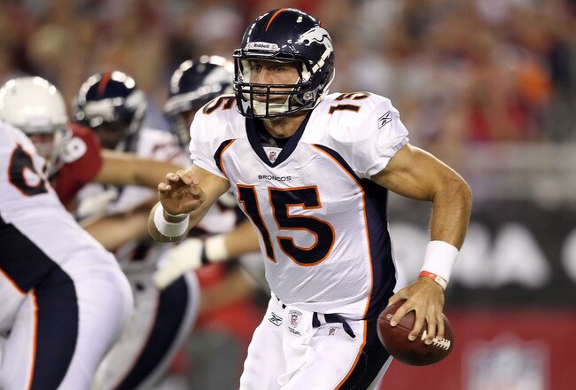 GLENDALE, AZ - SEPTEMBER 01:  Quarterback Tim Tebow #15 of the Denver Broncos scrambles with the football during the preseason NFL game against the Arizona Cardinals at the University of Phoenix Stadium on September 1, 2011 in Glendale, Arizona.  The Cardinals defeated the Broncos 26-7.  (Photo by Christian Petersen/Getty Images)