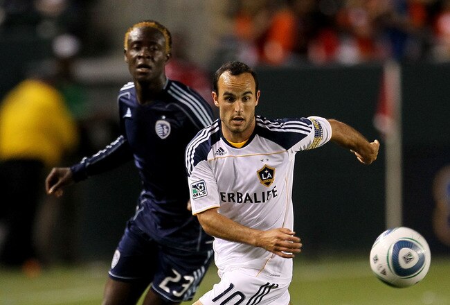 CARSON, CA - MAY 14:  Landon Donovan #10 of the Los Angeles Galaxy races for the ball against Kei Kamara #23 of Sporting Kansas City at The Home Depot Center on May 14, 2011 in Carson, California.  The Galaxy won 4-1.  (Photo by Stephen Dunn/Getty Images)