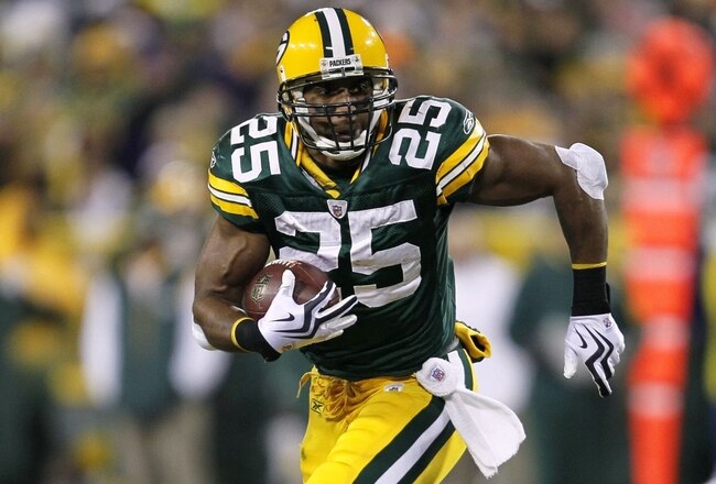 GREEN BAY, WI - DECEMBER 7:  Ryan Grant #25 of the Green Bay Packers runs the ball in the first quarter against the Baltimore Ravens at Lambeau Field on December 7, 2009 in Green Bay, Wisconsin.  (Photo by Jonathan Daniel/Getty Images)