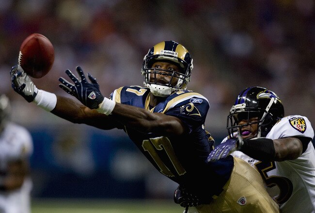 ST. LOUIS, MO - AUGUST 23: Donnie Avery #17 of the St. Louis Rams attempts to make a catch against Corey Ivy #35 of the Baltimore Ravens at the Edward Jones Dome August 23, 2008 in St. Louis, Missouri. (Photo by Dilip Vishwanat/Getty Images)