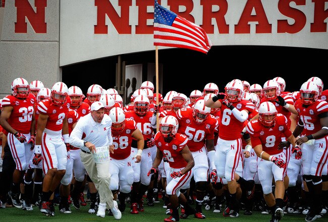 LINCOLN, NE - SEPTEMBER 3: Head Coach Bo Pelini leads his Nebraska Cornhuskers onto the field against the Chattanooga Mocs before their game at Memorial Stadium September 3, 2011 in Lincoln, Nebraska. Nebraska won 40-7. (Photo by Eric Francis/Getty Images)