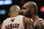 CHICAGO, IL - APRIL 18: Carlos Boozer #5 of the Chicago Bulls whispers into the ear of teammate Taj Gibson #22 as a member of the Indiana Pacers goes to the foul line in Game Two of the Eastern Conference Quarterfinals in the 2011 NBA Playoffs at the United Center on April 18, 2011 in Chicago, Illinois. NOTE TO USER: User expressly acknowledges and agrees that, by downloading and/or using this photograph, User is consenting to the terms and conditions of the Getty Images License Agreement. (Photo by Jonathan Daniel/Getty Images)