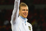 PORT ELIZABETH, SOUTH AFRICA - JULY 10:  Per Mertesacker of Germany celebrates victory and third place following the 2010 FIFA World Cup South Africa Third Place Play-off match between Uruguay and Germany at The Nelson Mandela Bay Stadium on July 10, 2010 in Port Elizabeth, South Africa.  (Photo by Lars Baron/Getty Images)