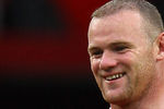 MANCHESTER, ENGLAND - AUGUST 28:  Wayne Rooney of Manchester United carries the match ball after scoring a hat trick in the Barclays Premier League match between Manchester United and Arsenal at Old Trafford on August 28, 2011 in Manchester, England.  (Photo by Alex Livesey/Getty Images)