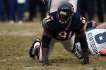 CHICAGO, IL - JANUARY 16:  Tommie Harris #91 of the Chicago Bears reacts after a sack of quarterback Matt Hasselbeck #8 of the Seattle Seahawks in the 2011 NFC divisional playoff game at Soldier Field on January 16, 2011 in Chicago, Illinois.  (Photo by Jonathan Daniel/Getty Images)