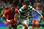GLASGOW, SCOTLAND - AUGUST 18: Ki Sung Yeung of Celtic is tackled by Geoffray Serey Die of FC Sion during the UEFA Europa League qualifying round, first leg match between Celtic and FC Sion at Celtic Park on August 18, 2011 in Glasgow, Scotland.  (Photo by Jeff J Mitchell/Getty Images)