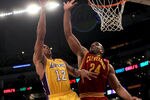 LOS ANGELES, CA - JANUARY 11:   Shannon Brown #12 of the Los Angeles Lakers shoots over Samardo Samuels #24 of the Cleveland Cavaliers at Staples Center on January 11, 2011 in Los Angeles, California.  The Lakers won 112-57.  NOTE TO USER: User expressly acknowledges and agrees that, by downloading and or using this photograph, User is consenting to the terms and conditions of the Getty Images License Agreement. (Photo by Stephen Dunn/Getty Images)