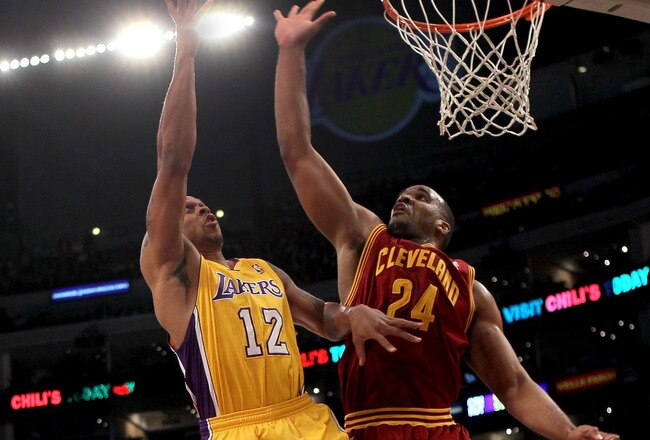 LOS ANGELES, CA - JANUARY 11:   Shannon Brown #12 of the Los Angeles Lakers shoots over Samardo Samuels #24 of the Cleveland Cavaliers at Staples Center on January 11, 2011 in Los Angeles, California.  The Lakers won 112-57.  NOTE TO USER: User expressly acknowledges and agrees that, by downloading and or using this photograph, User is consenting to the terms and conditions of the Getty Images License Agreement. (Photo by Stephen Dunn/Getty Images)