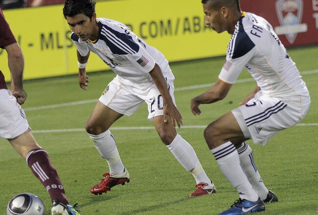 COMMERCE CITY, CO - JUNE 18:  Conor Casey #9 of the Colorado Rapids controls the ball against the defense of A.J. DeLaGarza #20 and Sean Franklin #5 of the Los Angeles Galaxy at Dick's Sporting Goods Park on June 18, 2011 in Commerce City, Colorado. The Galaxy defeated the Rapids 3-1.  (Photo by Doug Pensinger/Getty Images)