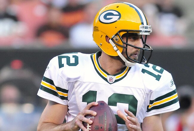 CLEVELAND, OH - AUGUST 13: Starting quarterback Aaron Rodgers #12 of the Green Bay Packers drops back for a pass during the first quarter against the Cleveland Browns at Cleveland Browns Stadium on August 13, 2011 in Cleveland, Ohio. The Browns defeated the Packers 27-17. (Photo by Jason Miller/Getty Images)