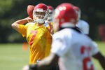 SAINT JOSEPH, MO - JULY 31:  Quarterback Matt Cassel #7 passes to Jamaal Charles #25 during Kansas City Chiefs Training Camp on July 31, 2011 in Saint Joseph, Missouri.  (Photo by Jamie Squire/Getty Images)