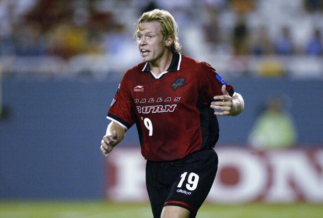 DALLAS - October 2:  Bobby Rhine #19 of the Dallas Burn questions a call during game three of the MLS Playoffs against the Colorado Rapids on October 2, 2002 at the Cotton Bowl in Dallas, Texas.  The Rapids defeated the Burn 2-1.  (Photo by Ronald Martinez/Getty Images)