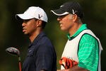 PONTE VEDRA BEACH, FL - MAY 12:  Tiger Woods and caddie Steve Williams look on from the fifth hole during the first round of THE PLAYERS Championship held at THE PLAYERS Stadium course at TPC Sawgrass on May 12, 2011 in Ponte Vedra Beach, Florida.  Woods withdrew after shooting a 42 on the front nine holes. (Photo by Streeter Lecka/Getty Images)