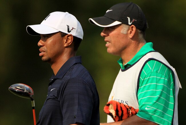 PONTE VEDRA BEACH, FL - MAY 12:  Tiger Woods and caddie Steve Williams look on from the fifth hole during the first round of THE PLAYERS Championship held at THE PLAYERS Stadium course at TPC Sawgrass on May 12, 2011 in Ponte Vedra Beach, Florida.  Woods withdrew after shooting a 42 on the front nine holes. (Photo by Streeter Lecka/Getty Images)