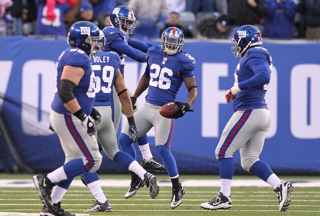 EAST RUTHERFORD, NJ - NOVEMBER 28:  Antrel Rolle #26 of the New York Giants celebrates his fumble recovery against the Jacksonville Jaguars during the final minutes of their 24-20 win on November 28, 2010 at The New Meadowlands Stadium in East Rutherford, New Jersey.  (Photo by Al Bello/Getty Images)