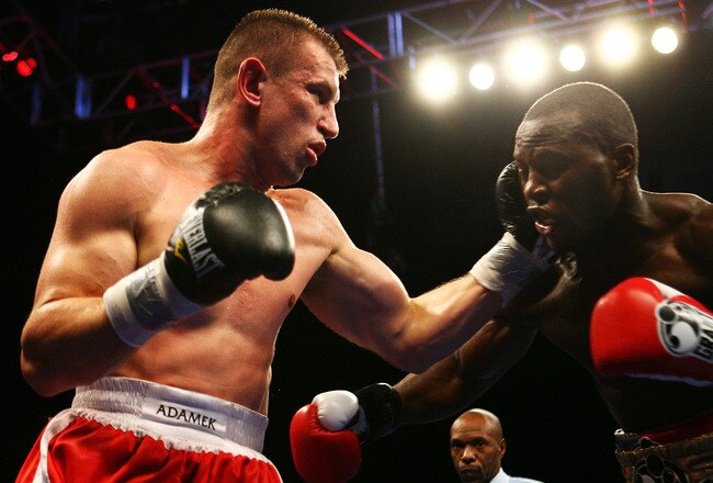 NEWARK, NJ - DECEMBER 11:  Tomasz Adamek punches Steve Cunningham  during their IBF Cruiserweight Championship fight on December 11, 2008 at The Prudential Center in Newark, New Jersey.  Tomask won a split decision.  (Photo by Al Bello/Getty Images)