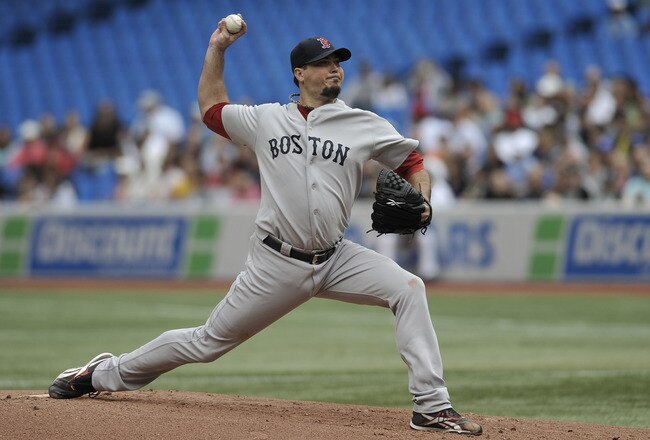 TORONTO, CANADA - SEPTEMBER 05:  Josh Beckett #19 of the Boston Red Sox delivers a pitch during MLB game action against the Toronto Blue Jays September 5, 2011 at Rogers Centre in Toronto, Ontario, Canada. (Photo by Brad White/Getty Images)