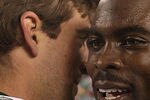PHILADELPHIA - SEPTEMBER 12:  Michael Vick #7 of the Philadelphia Eagles walks off the field and greets Aaron Rodgers #12 of the Green Bay Packers after a loss at Lincoln Financial Field on September 12, 2010 in Philadelphia, Pennsylvania. The Packers beat the Eagles 27-20.  (Photo by Mike Ehrmann/Getty Images)