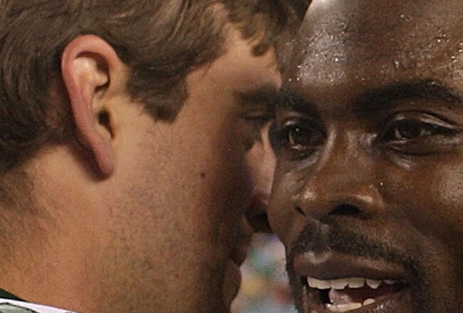 PHILADELPHIA - SEPTEMBER 12:  Michael Vick #7 of the Philadelphia Eagles walks off the field and greets Aaron Rodgers #12 of the Green Bay Packers after a loss at Lincoln Financial Field on September 12, 2010 in Philadelphia, Pennsylvania. The Packers beat the Eagles 27-20.  (Photo by Mike Ehrmann/Getty Images)