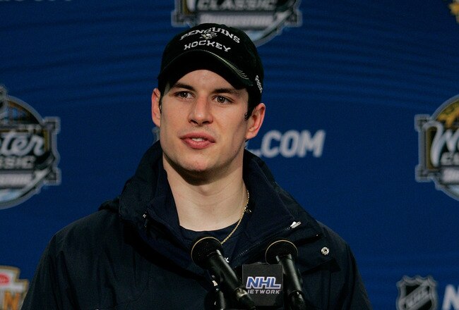PITTSBURGH, PA - JANUARY 01: Sidney Crosby #87 of the Pittsburgh Penguins talks to the media during a press conference after losing 3-1 to the Washington Capitals during the 2011 NHL Bridgestone Winter Classic at Heinz Field on January 1, 2011 in Pittsburgh, Pennsylvania.  (Photo by Justin K. Aller/Getty Images)